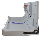 The Frost 1125 Baby Change Table in grey, displayed in open position, with clear safety labels and a secure blue safety strap for a reliable and hygienic changing station.