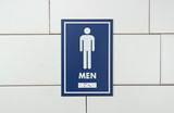 Frost 960 male washroom signage in bold blue with white pictogram and braille, offering clear and accessible direction for men's restrooms.