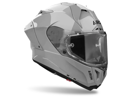 Right side profile of the cement-grey Airoh GP800 Solid helmet showing its clean styling, carbon-fiber shell and wide Optical Class 1 racing visor.