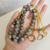 Natural stone tasbih prayer beads with crescent and star tassel design