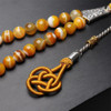 Silver tassel and agate muslim prayer beads close-up detail