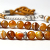 Natural agate stone prayer beads showing unique banded patterns