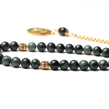 Close-Up of Natural Stone Tasbih Prayer Beads in Green Olive