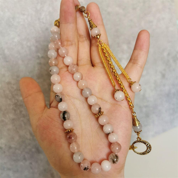 Hand Holding Pink Natural Stone Muslim Prayer Beads