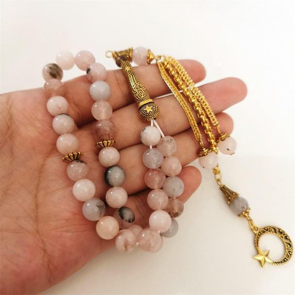 Close-up of Natural Pink Stone Islamic Prayer Beads