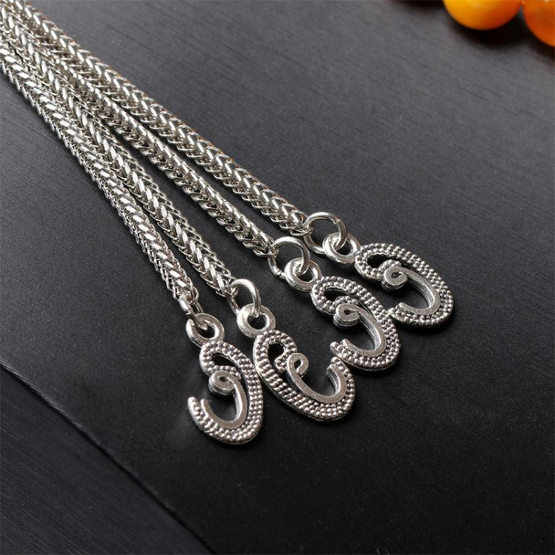 Silver Tassel Detail on Amber Color Tasbih Prayer Beads