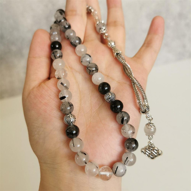 Handheld Natural Stone Tasbih Prayer Beads held in Hand for Size Reference