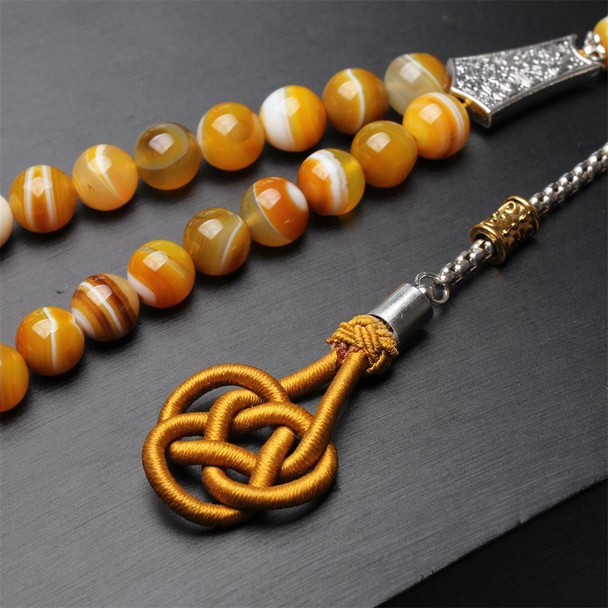 Silver tassel and agate muslim prayer beads close-up detail