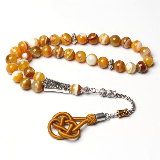 Detailed view of agate tasbih prayer beads and decorative tassel