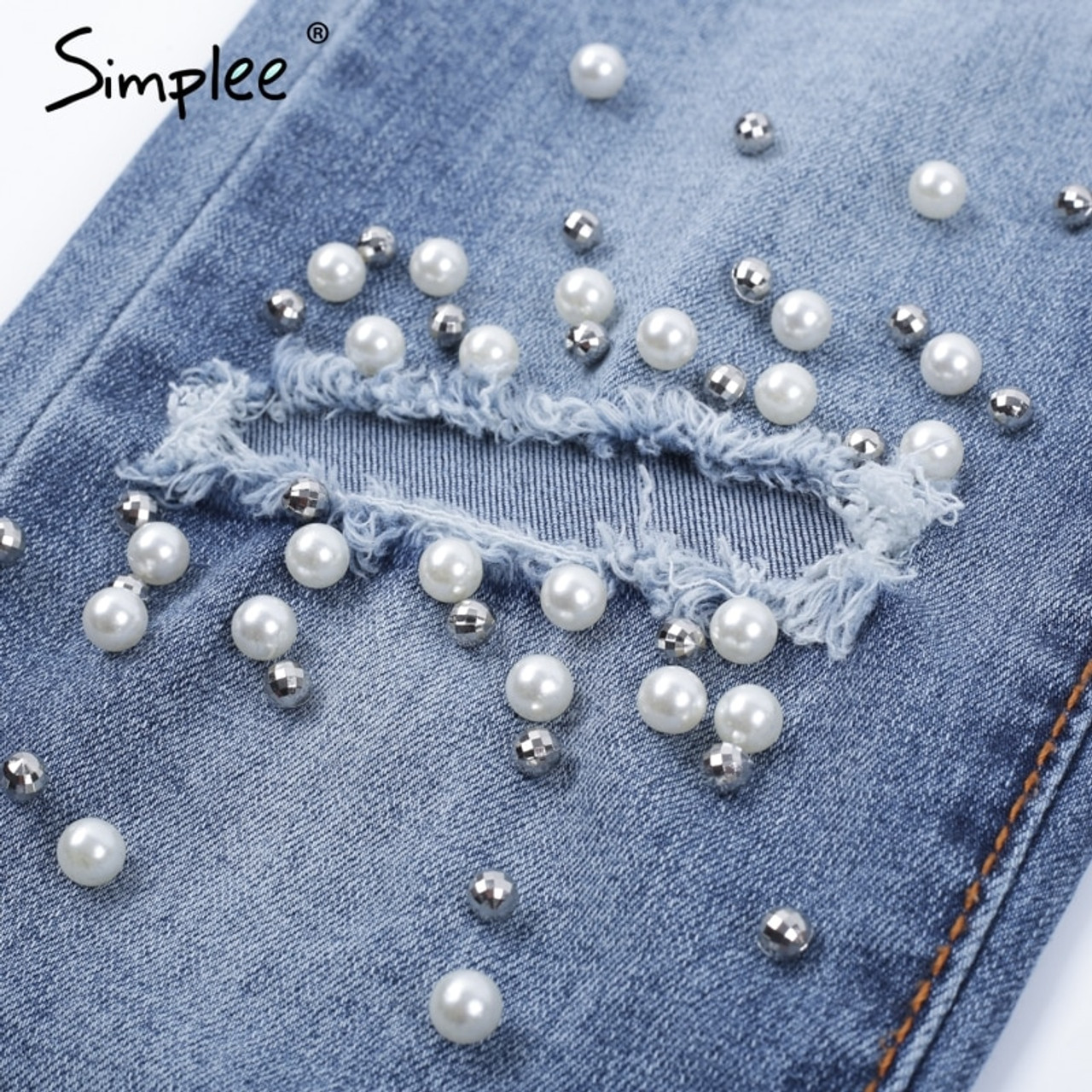 ripped jeans with pearls on them