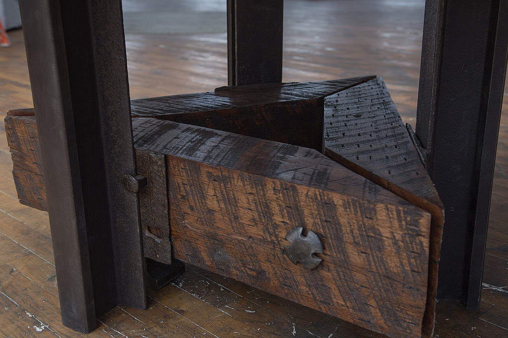 artisan hand crafted iron and steel base table