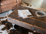 Industrial modern coffee table with wood timber and steel legs.