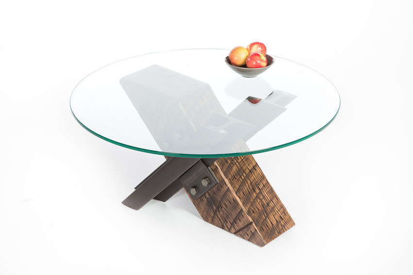 x-shaped three-legged coffee table from reclaimed steel and salvaged wood with round glass top