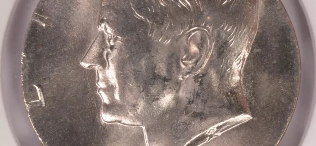 1977-D Kennedy Half Transitional Off-Metal Find in Circulation 