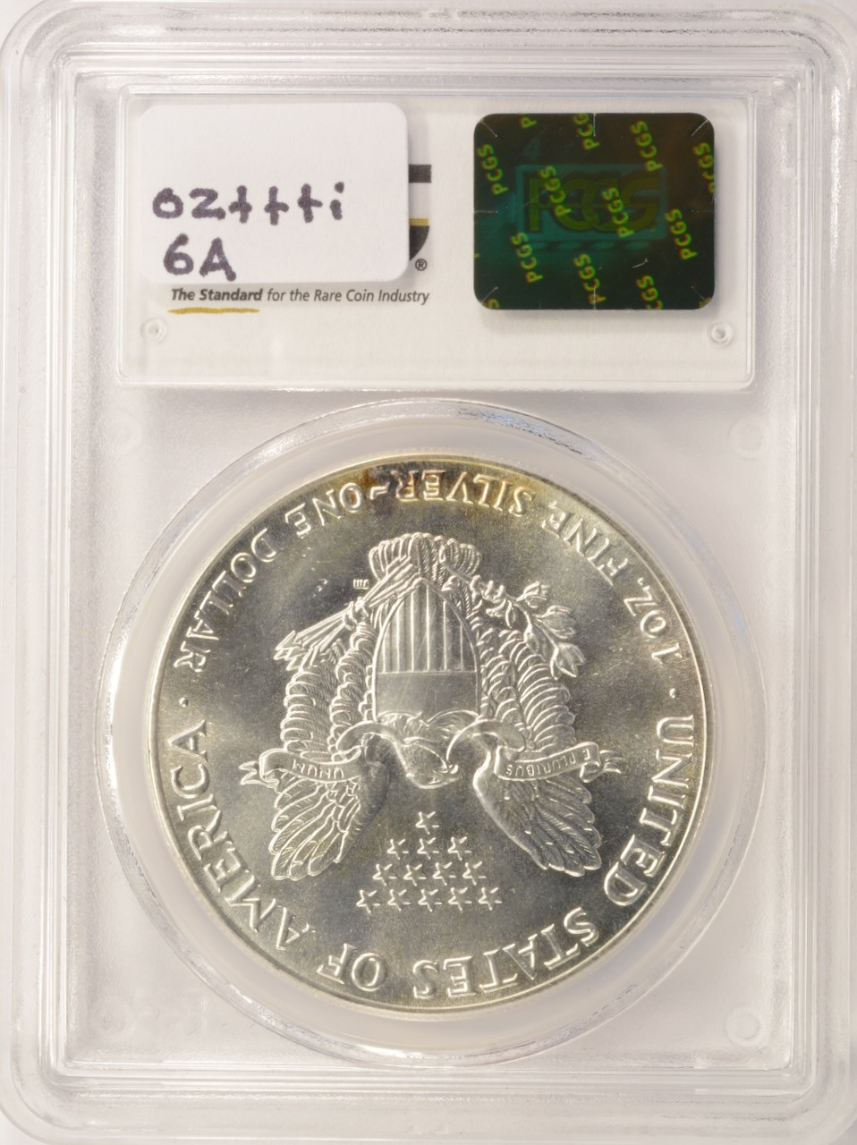 PCGS 1986 $1 Silver Eagle Struck Thru Emory Sanding Disc PCGS MS64