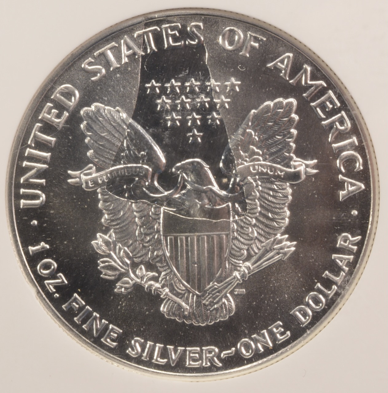 1990 $1 Silver Eagle Struck Thru Reverse NGC MS69