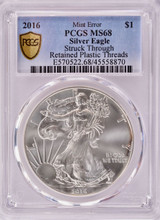 2016 PCGS $1 Silver Eagle Struck Thru Retained Plastic Threads Obverse MS68
