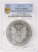 2014 $1 Silver Eagle Retained Struck-Thru Plastic PCGS MS67