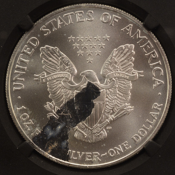 2003 $1 Silver Eagle Large Struck Thru Reverse NGC MS68