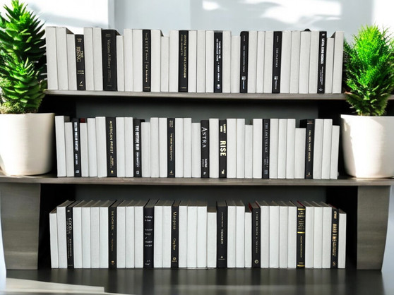 100 Vol. White parchment bound spines with a touch of modern hardbound books in black