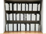 100 Vol. White parchment bound spines with a touch of modern hardbound books in black