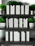 White parchment bound spines with a touch of modern hardbound books in black for a very clean look. Book covers vary.- 50 books/ 8.5"-9.5"