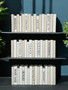 White and natural parchment bound books with a touch of faux titles. Book covers vary.- 50 books/ 8.5"-9.5"