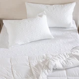Safety Assured Waterproof Pillow Protector in White by Hilton | Pillow Talk