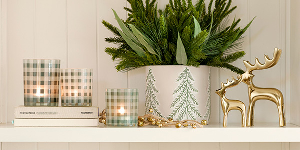 Pillow Talk Christmas decorations sit on a bookshelf