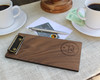 Custom wooden check presenter displayed on an upscale restaurant table