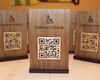 Custom engraved QR code menu sign in walnut veneer