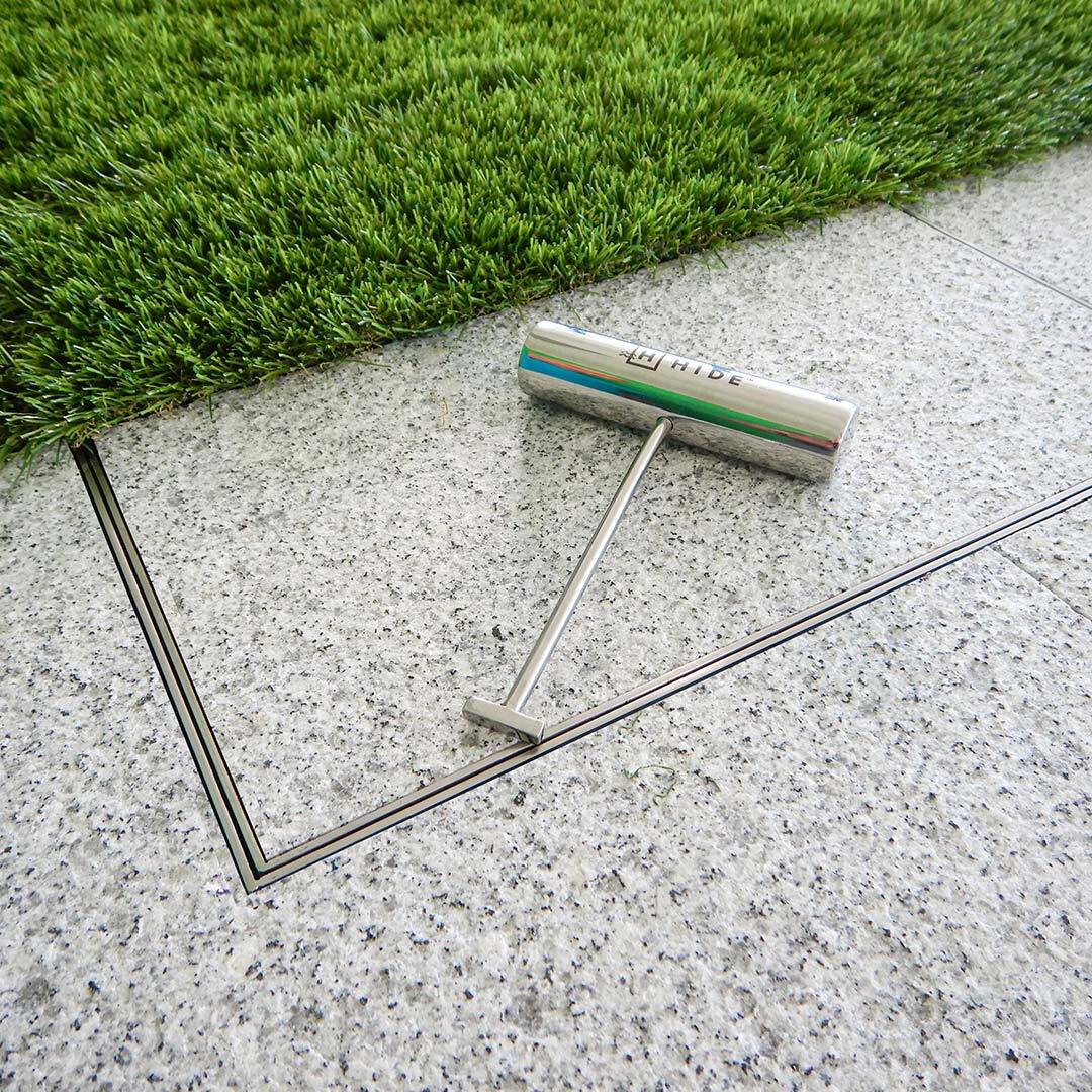 HIDE cover in stone with turf