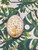 Beach City Boutique Close-up of Oval Peacock Soap Bar - White Glitter Relief on Gold Background 