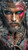 intense male warrior portrait with blue eyes tribal tattoos red face paint and rugged styling