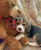 beagle puppy cuddling with teddy bear wrapped in blanket soft cozy heartwarming scene