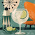 Refreshing gin and tonic style cocktail with lime garnish in a balloon glass beside a vintage cocktail shaker by 1000 No Kotoba.
