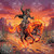 A skeletal cowboy rides a blazing fire horse across a desert landscape at sunset.