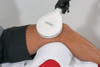 emFieldPro large static applicator positioned over the knee and upper thigh for contact-free High Energy Inductive Therapy