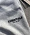Close-up of soft light oatmeal fabric texture on pants