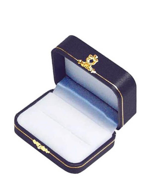 Blue leatherette exterior double slot ring box with white flock interior and gold tooling and latch.
