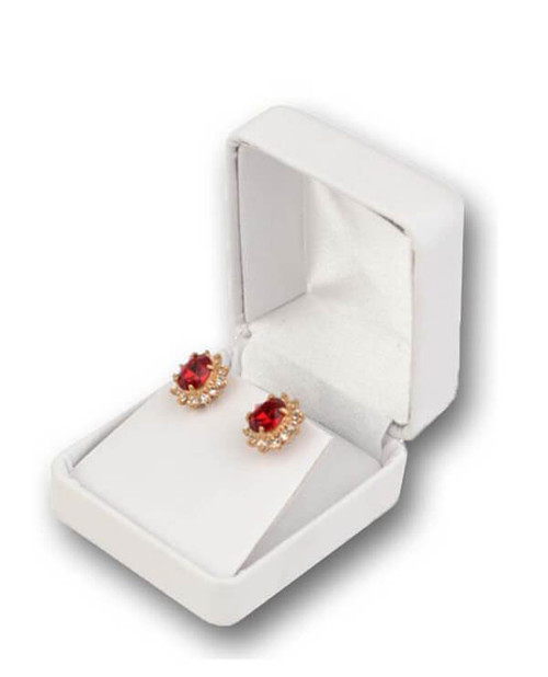 Metal small earring or pendant box with white leatherette exterior and interior with white satin puff.