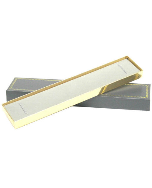 Long bracelet jewelry box with grey exterior with gold printed rim, gold foil bottom and velvet insert.