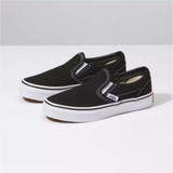 Vans Kids' Classic Slip-On shoes in navy blue canvas with white sole.