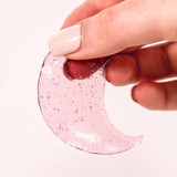 Patchology Serve Chilled Rosé Eye Gels held in hand showing product