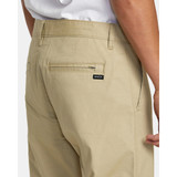 RVCA Men's Daggers Tech Technical Chinos in olive green, angled view