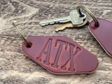 Tres Cuervos Motel Keychain ATX front view
