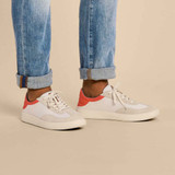 The Olukai Men's Punini Sneaker Shoes in the colorway Off White/ Molten Orange