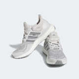 The orange adidas Woman's Ultraboost 1.0 in the colorway Grey One / Grey Three / Cloud White