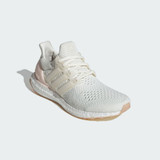 The Adidas rose Woman's Ultraboost 1.0 in the colorway Off White / Off White / Wonder Quartz