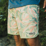 The Howler Brothers Men's Bruja Boardshorts in the Monstera Mash Sherbet Colorway